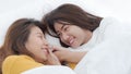 Couple of homosexual women on white bed,Lesbians Asian women are