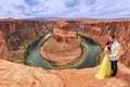 A couple on a honeymoon road trip at Horseshoe Bend, Arizona