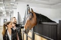 Couple with horse in the stable Royalty Free Stock Photo