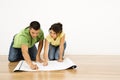 Couple with house plans. Royalty Free Stock Photo