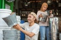 Couple of housewares shop owner checks the stock of goods