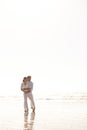 Couple, hug and beach with love, vacation or summer holiday together for embrace or outdoor romance. Man and woman