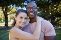 Couple hug, date outdoor and portrait with nature, love and commitment in park with interracial relationship. Trust Royalty Free Stock Photo