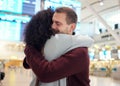 Couple, hug and farewell at airport for travel, trip or flight in goodbye for long distance relationship. Man and woman