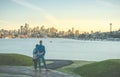 A couple hug and looking Seattle cityscape with sunset ,Seattle,WAshington,USA. Royalty Free Stock Photo