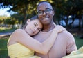 Couple hug in portrait with date outdoor, nature and happy people in interracial relationship with commitment in park Royalty Free Stock Photo