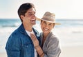 Couple hug, portrait and smile at beach for sunshine, holiday romance, love together and honeymoon. Happy woman, man and