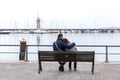 Couple hugging on a bench. Young couple sitting on a wooden bench Royalty Free Stock Photo