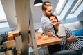 Couple hugging and drinking juice in kitchen