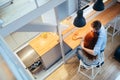 Couple hugging and drinking juice in kitchen