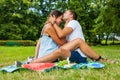 Couple hugging and having picnic in park Royalty Free Stock Photo