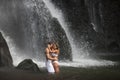 Couple Hugging Under Waterfalls Royalty Free Stock Photo