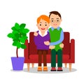 Couple hugging. Young people are sitting on sofa embracing each other. Romantic time together. Happy man and woman in relationship Royalty Free Stock Photo