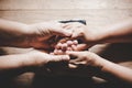 Couple of husband and wife are holding hands and pray together