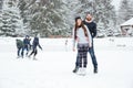 Couple in ice skates standing outdoors Royalty Free Stock Photo