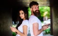 Couple ignore real communication. Couple chatting smartphones. Girl and bearded man stand back to back porch or Royalty Free Stock Photo