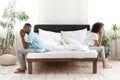 Couple ignoring each other in bed after quarrel Royalty Free Stock Photo