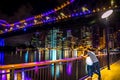 Couple on illuminated embankment