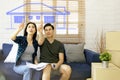 Couple imagines designing a beautiful one-story house. Royalty Free Stock Photo