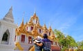 Couple Impressed by the Amazing Loha Prasat which Adorned with 37 Golden Spires inside Wat Ratchanatdaram Temple