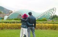 Couple Impressed by The Bridge of Peace, an Iconic Landmark of Tbilisi, Georgia