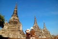 Couple Impressed by the Historic Pagoda Ruins of Wat Phra Si Sanphet in Ayutthaya Historical Park, Thailand