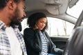 Couple Inside Car After Road Traffic Accident With Female Passenger Suffering Whiplash Injury Royalty Free Stock Photo