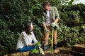 Couple interacting with each other while gardening in the garden