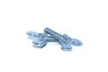 A couple of isolated galvanized industrial steel screws on white background A couple of isolated galvanized industrial wing bolts
