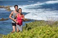 Couple of joggers running on the seaside