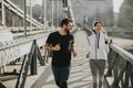 Couple jogging on Chain Bridge in Budapest Royalty Free Stock Photo