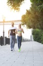 Couple jogging outside, runners training outdoors working out in Royalty Free Stock Photo