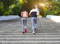 Couple jogging outside, runners training outdoors working out in Royalty Free Stock Photo