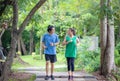 Couple jogging and running in natural environment on summer morning Royalty Free Stock Photo