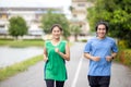 Couple jogging and running in natural environment on summer morning Royalty Free Stock Photo