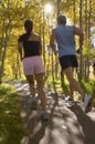 Couple Jogging Through Woodland Royalty Free Stock Photo