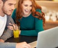 Couple, juice and laptop in cafe with smile, connectivity and internet for laughter. People, man and woman in restaurant Royalty Free Stock Photo