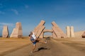 Couple jump near huge Gate of Allah, Ras Mohammed national park. Desert