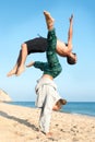 Couple jumping in the beach Royalty Free Stock Photo