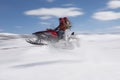 Couple Jumping Snowmobile In Snow Royalty Free Stock Photo