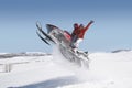 Couple Jumping Snowmobile In Snow Royalty Free Stock Photo