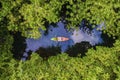 couple kayak in jungle of Krabi Thailand, men and woman kayak in tropical jungle mangrove forest.