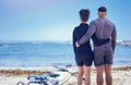 Couple, kayak and outdoor for travel adventure at a beach with a partner for teamwork. Behind a man and woman with a Royalty Free Stock Photo