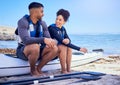 Couple, kayak and outdoor for travel adventure at a beach with a partner for teamwork. A happy man and woman with a Royalty Free Stock Photo