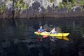 Couple kayaking a kayak over lake Taupo New Zealand Royalty Free Stock Photo