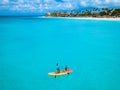 Couple Kayaking in the Ocean on Vacation Aruba Caribbean sea Royalty Free Stock Photo