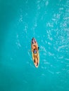 Couple Kayaking in the Ocean on Vacation Aruba Caribbean sea, man and woman mid age kayak in ocean blue clrea water