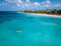 Couple Kayaking in the Ocean on Vacation Aruba Caribbean sea, man and woman mid age kayak in ocean blue clrea water Royalty Free Stock Photo