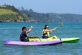 Couple kayaking at sea