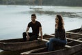 Couple with traditional canoe together on a lake Royalty Free Stock Photo